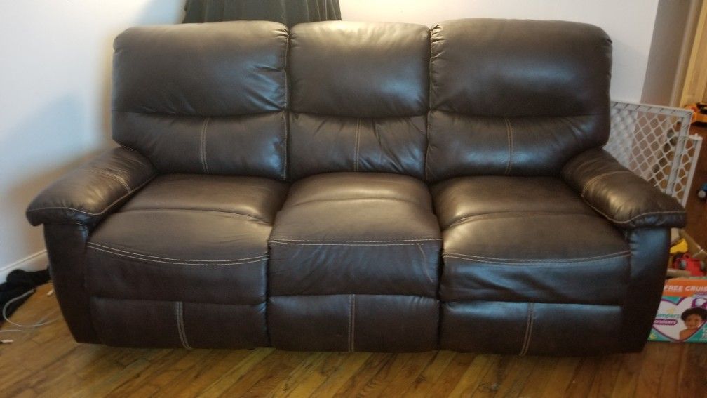 Reclining leather sofa