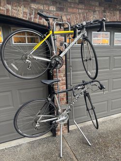 2 road bikes with storage stand