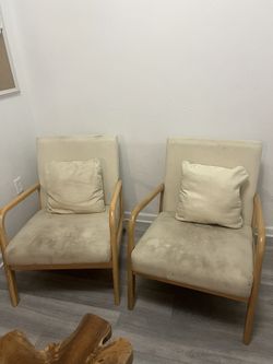Two Wooden Chairs with Pillows
