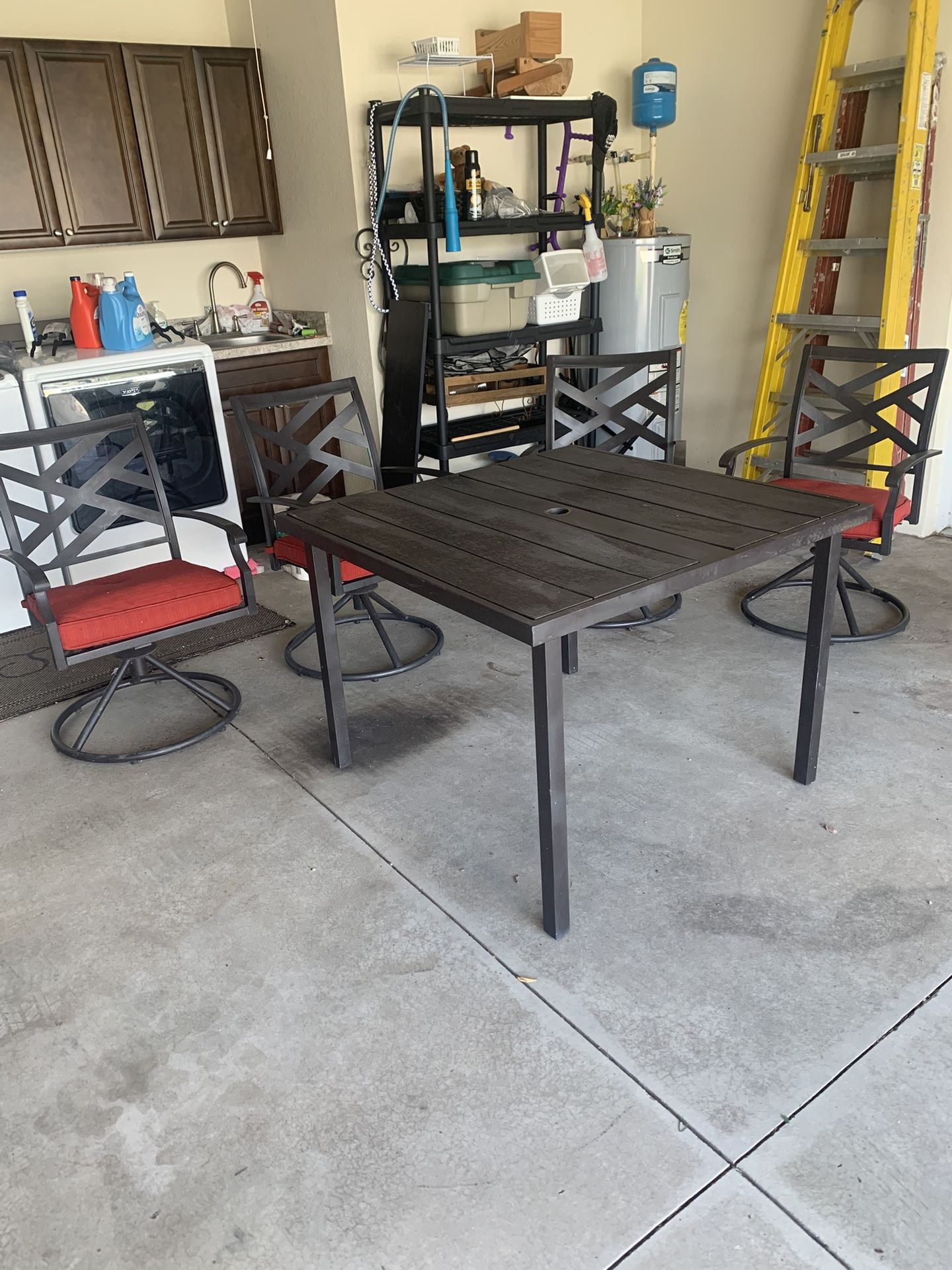 Outdoor Table And 4 Chairs Also Includes An Umbrella And Base