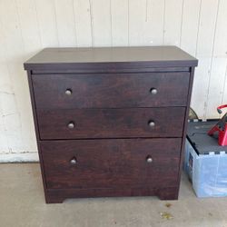 Small brown wooden storage dresser