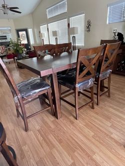 Counter height dinning room table with seating for 6.