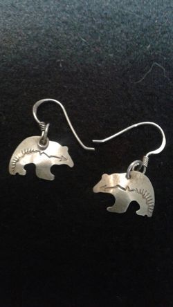 Silver earrings bears $10
