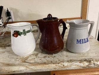 Three Country Style Pitchers