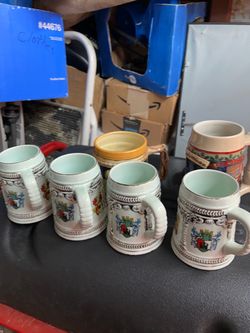 Collection of six beer, mugs, Budweiser, and German and crests
