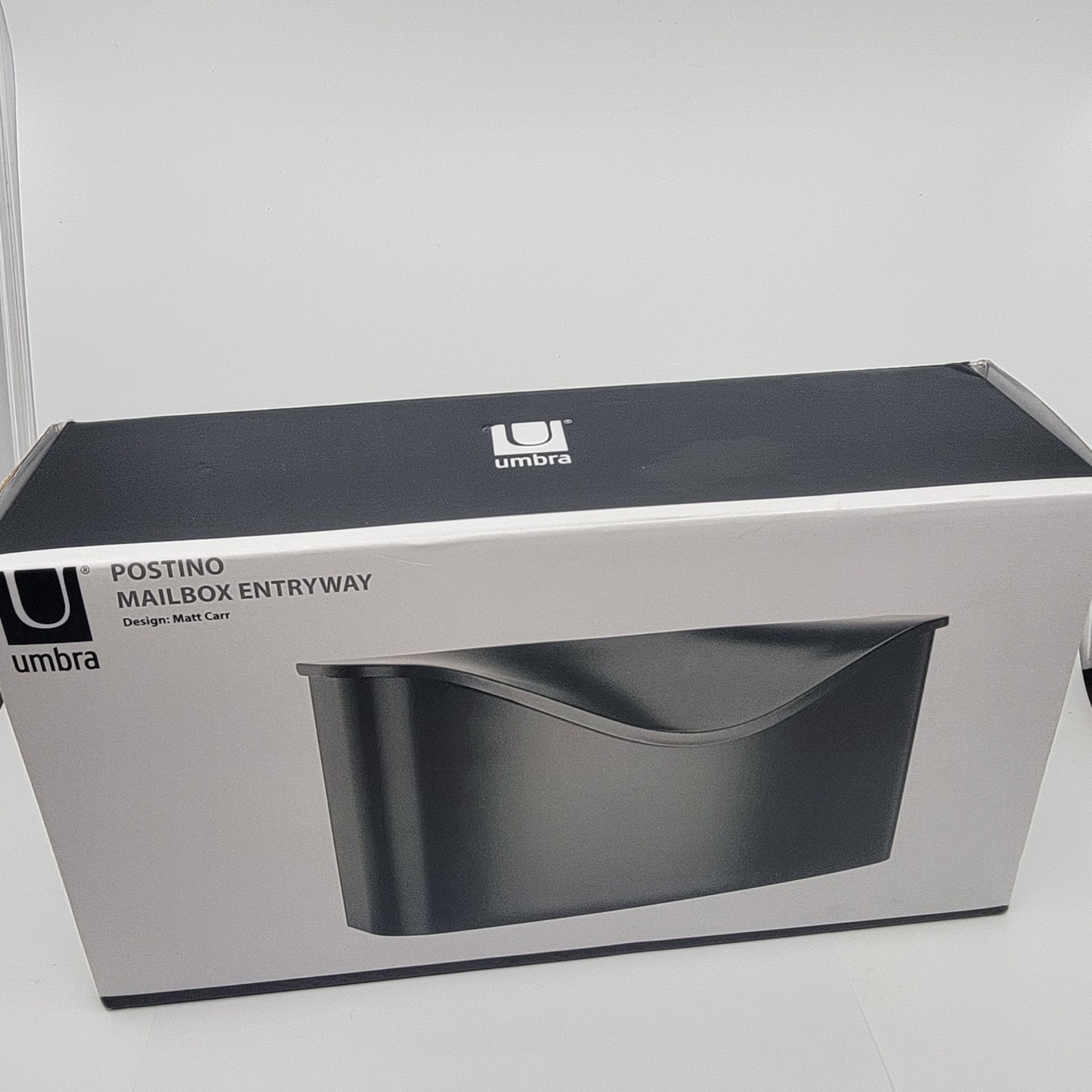 Umbra 460322-040 Postino Wall-Mount Mailbox, Black New, sealed - box
open, but contents are sealed.
Dimensions 14.5x7.75x4.5inches (37x20x11.4cm)
w