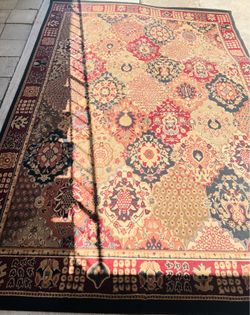 90x130 burgundy with black border Persian style area rug. Used but in great condition.