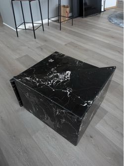 Pair of sculptural geometric black marble nesting coffee tables