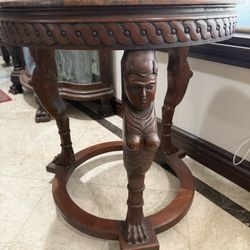 Antique carved mahogany figural deco  table with marble top.