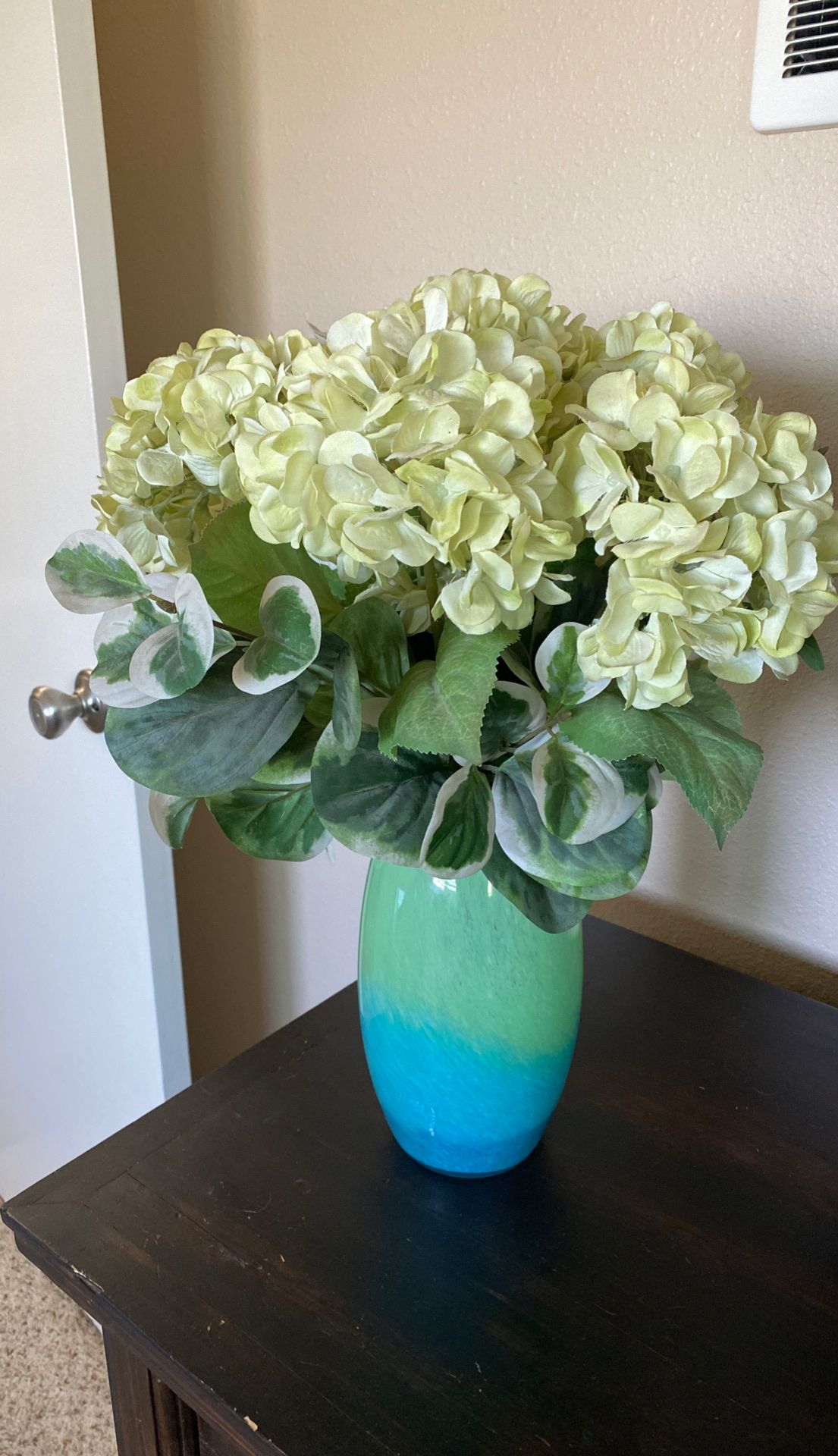 Faux flower arrangement and vase