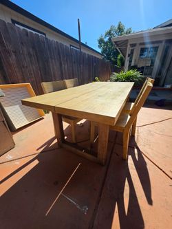 Table and set of 4 chairs ( real wood -made in Thailand)
