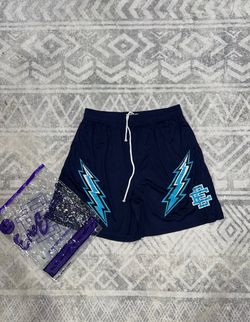 Eric Emanuel navy blue shorts with blue lightning bolt graphics