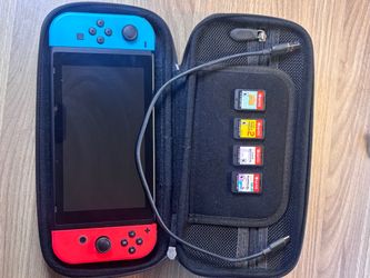 Nintendo Switch with Case, Cable, and 4 Games