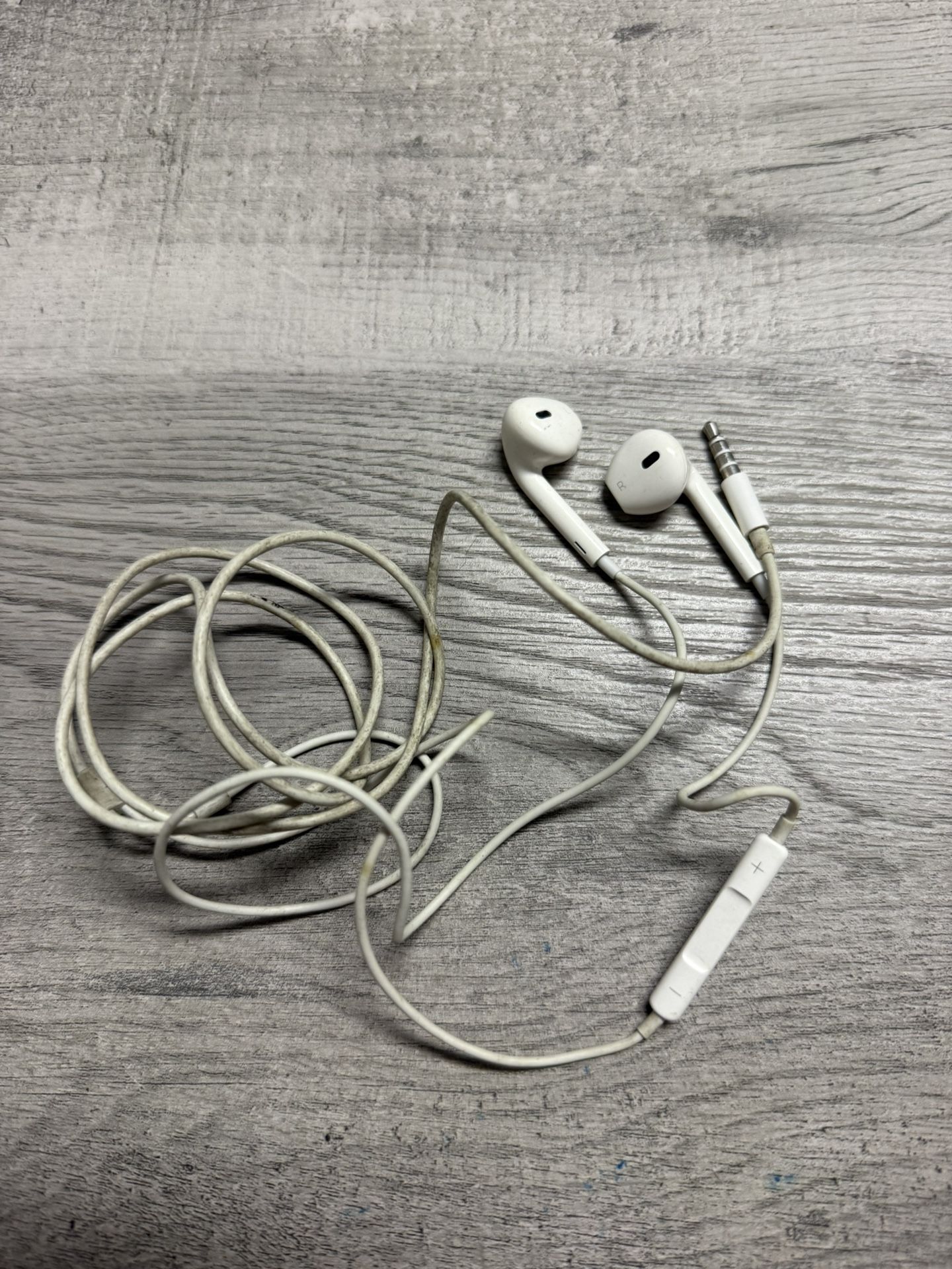 Apple EarPods with a 3.5mm headphone jack.