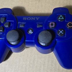 Blue DualShock 3 Sixaxis ControllerBlack Sony PlayStation DualShock 3 Sixaxis controller.