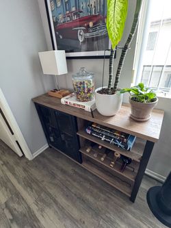 Industrial-style bar cabinet in great condition — barely any wear, still looks and functions like new.