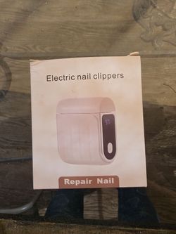 electric nail clipper. Corta uñas eletrico