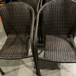 4 Stackable Brown All Weather Wicker/Rattan Outdoor/Dining Chairs W/Steel Frame(See & Click On Pictures). Still In Very Good Condition 