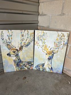 Set of two colorful deer art canvases.