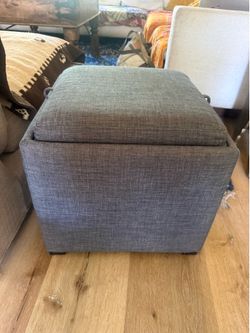Grey ottoman with storage and tray table