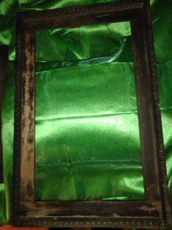 ANTIQUE PRIMITIVE WOODEN HANGING MIRROR FRAME.