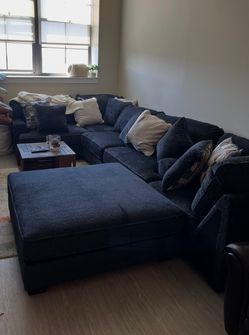 L-shaped couch with very large ottoman