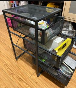 The three-tire cabinet(wire mesh) has two small wheels(used) Length 13.5 Width 12 Height 22
