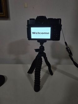 Black Digital Camera with Mini Tripod