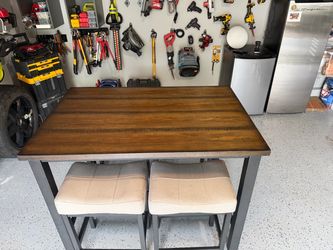 5 Piece dining room set (with tuck-away in stools )