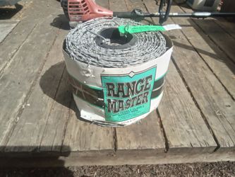 New Galvanized Steel Spool of Range Master Barbed Wire New Condition. $30.00.