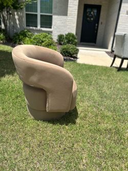 Tan swivel upholstered chair, new