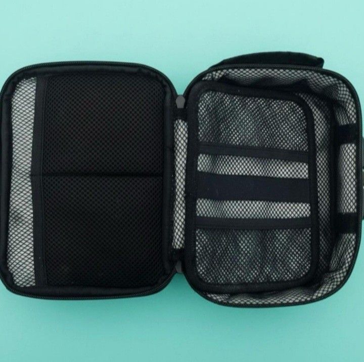 TRAVEL TOILETRY BAG: 8.5"X6.5"X3.25". 3-DIGIT COMBO LOCK FOR SECURITY. LIKE NEW.