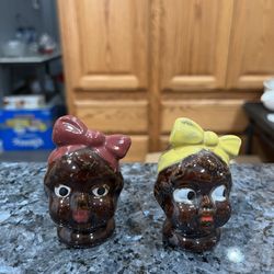 Vintage Old pair of salt and pepper shakers with original cork stoppers.  Size approximately 3 inches tall.  Preowned.  