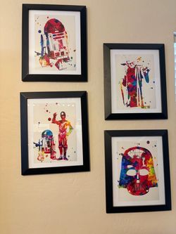 Set of four Star Wars art prints in frames