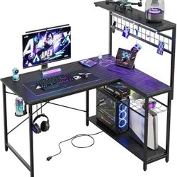 Bestier Gaming Desk 51" L-Shaped, with Power Outlets & LED Lights- 4 Tier Shelves, Reversible Gamer Table with Hooks & Cup Holder for Home Office Carb