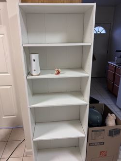 White Book shelf 6 feet tall 1 foot deep 2 feet wide