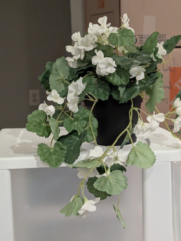 Faux Plant in Plastic Vase – A Touch of Green for Any Space