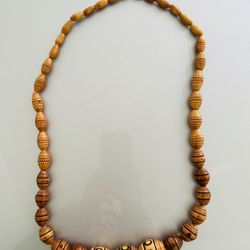 Wooden beaded necklace with hand-decorated beads