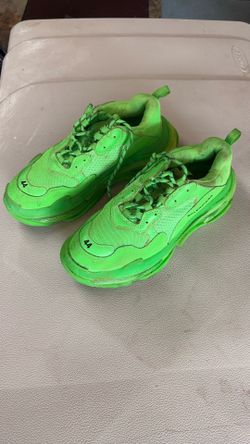 Balenciaga Triple S Clear Sole Trainers in a vibrant neon green colorway.