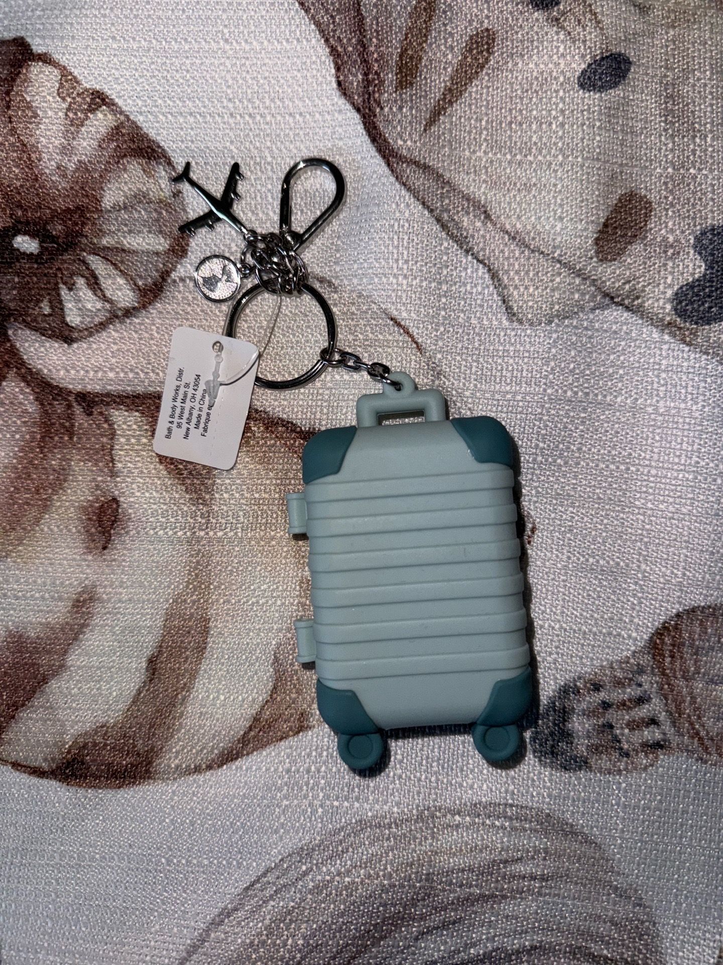 Suitcase hand sanitizer holder