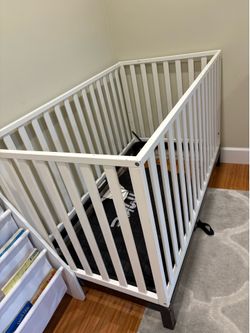White wooden baby toddler crib