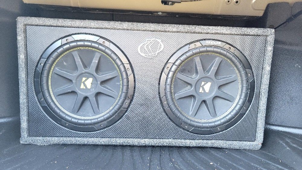 "Upgrade Your Car's Audio System: Two 12" Kickers with Amp for Sale!"
