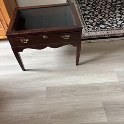 Glass top display table with drawer