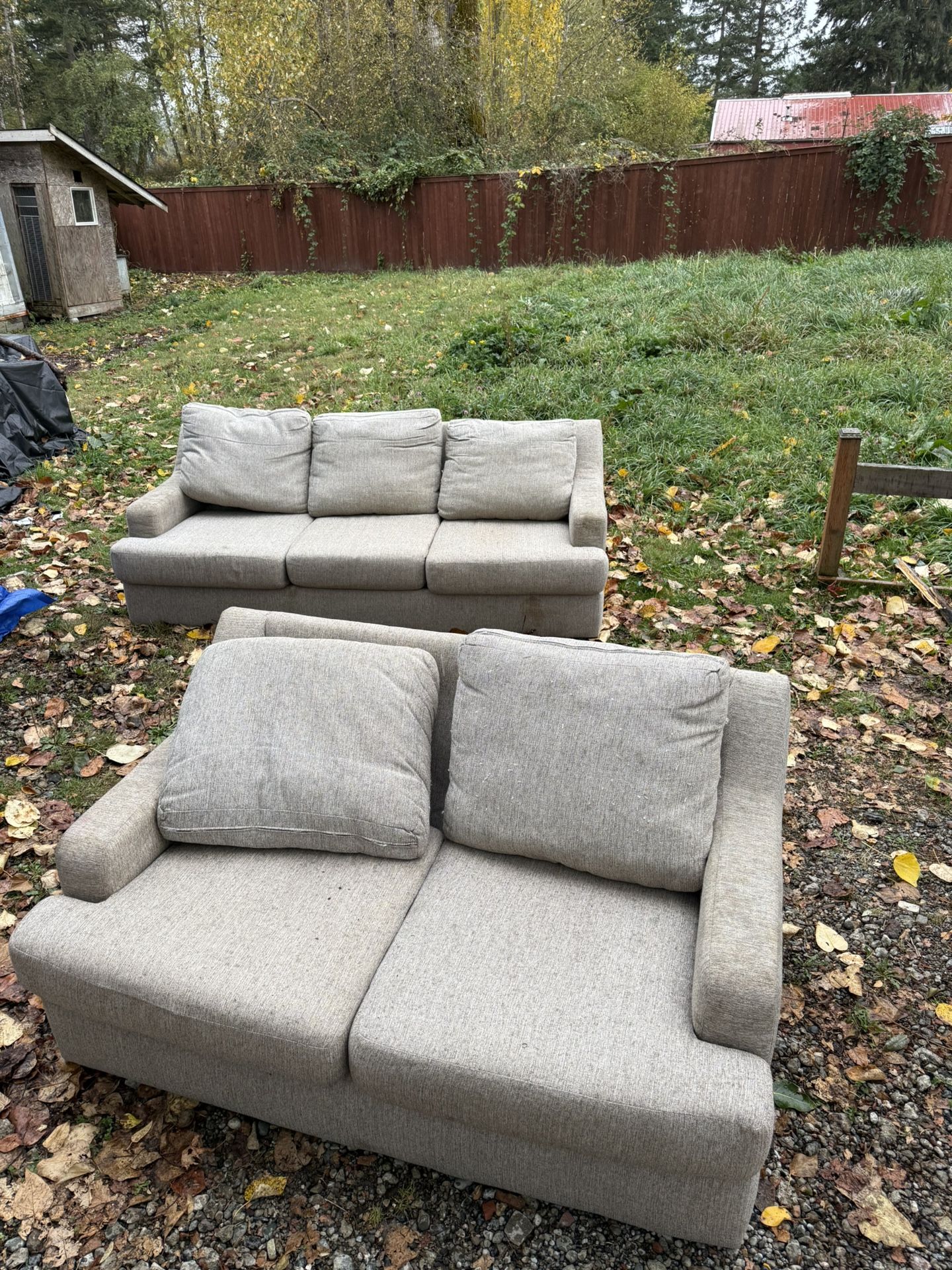 Two gray sofas. Double and triple seat