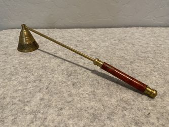 Vintage Brass Candle Snuffer with wood accent on the handle.