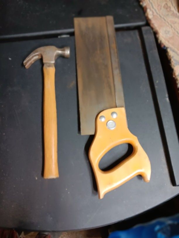 Hand Saw And Hammer