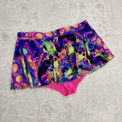 Bright multicolor psychedelic swim skirt with coordinating hot pink briefs. Soft, quick-dry fabric made for pool and beach play. Elastic waist for eas