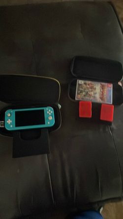 2 switch cases with a Nintendo switch lite blue