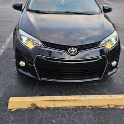 Toyota Corolla S car, 2016 model year. 128,000 miles. Black color, 4 doors.