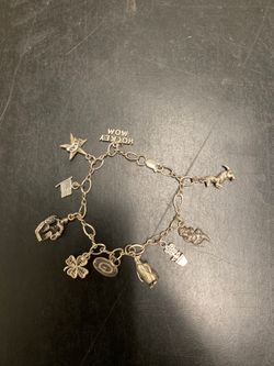 Sterling silver hockey mom bracelet with 10 charms
